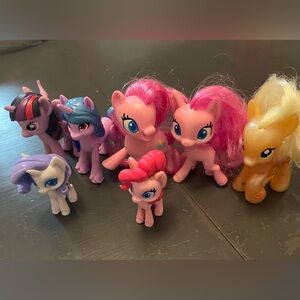 My little pony 7 different ponies purple white pink yellow